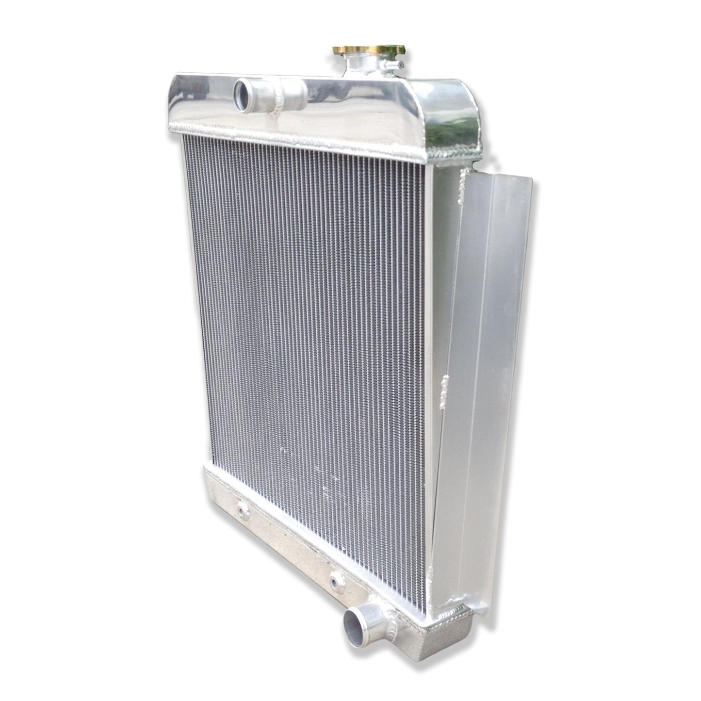 Right side profile of the aluminum radiator for a 1956 Chevy pickup, showing the passenger-side port and sturdy construction.