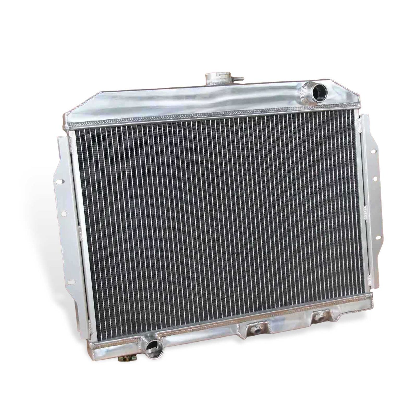 Detailed close-up of the TIG-welded tanks and high-density cooling fins on the 3 Row Aluminum Radiator for 1958-1974 AMC V8s.