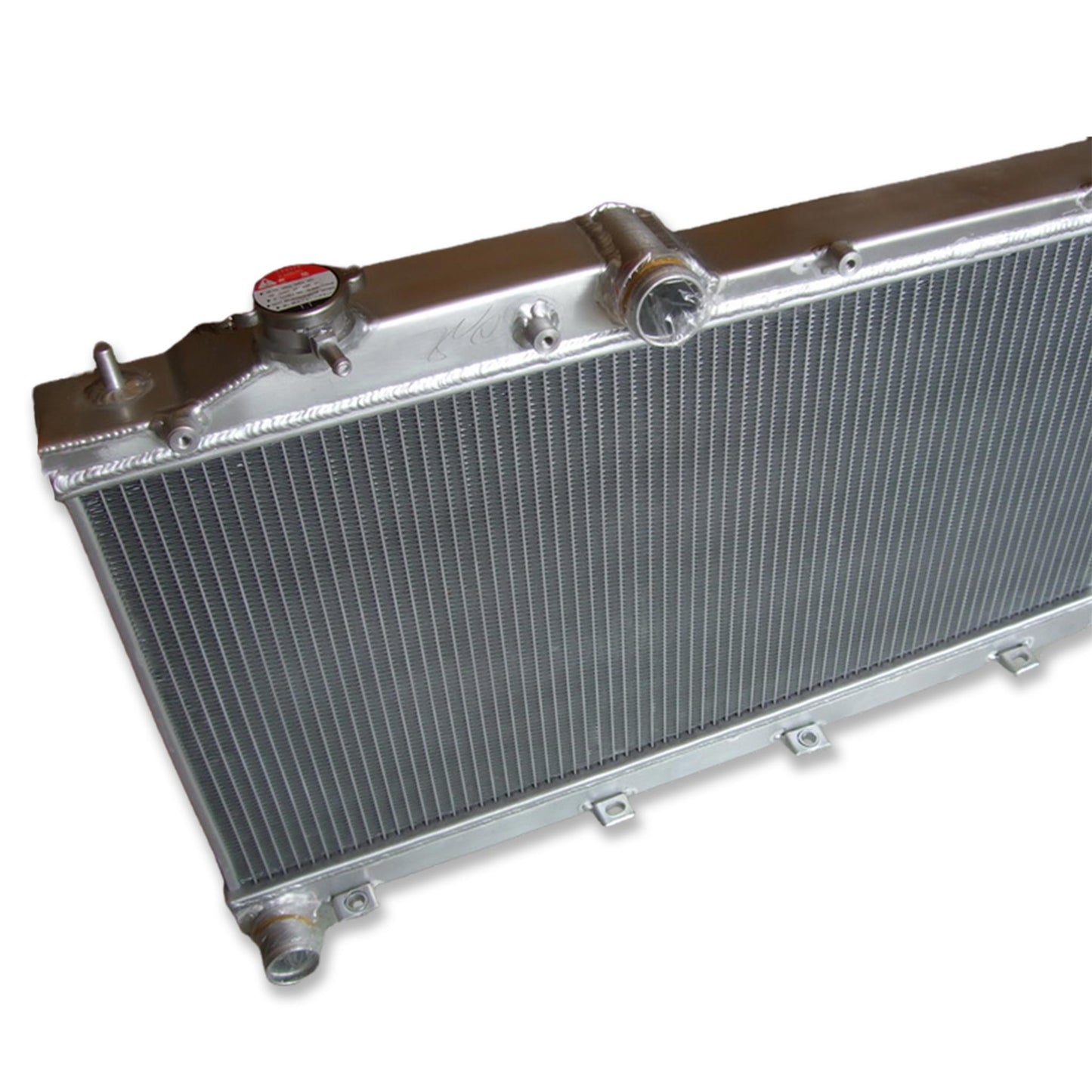 Detailed close-up of the TIG welds and high-efficiency 2-row core of the radiator for a 08-14 Subaru WRX STI.