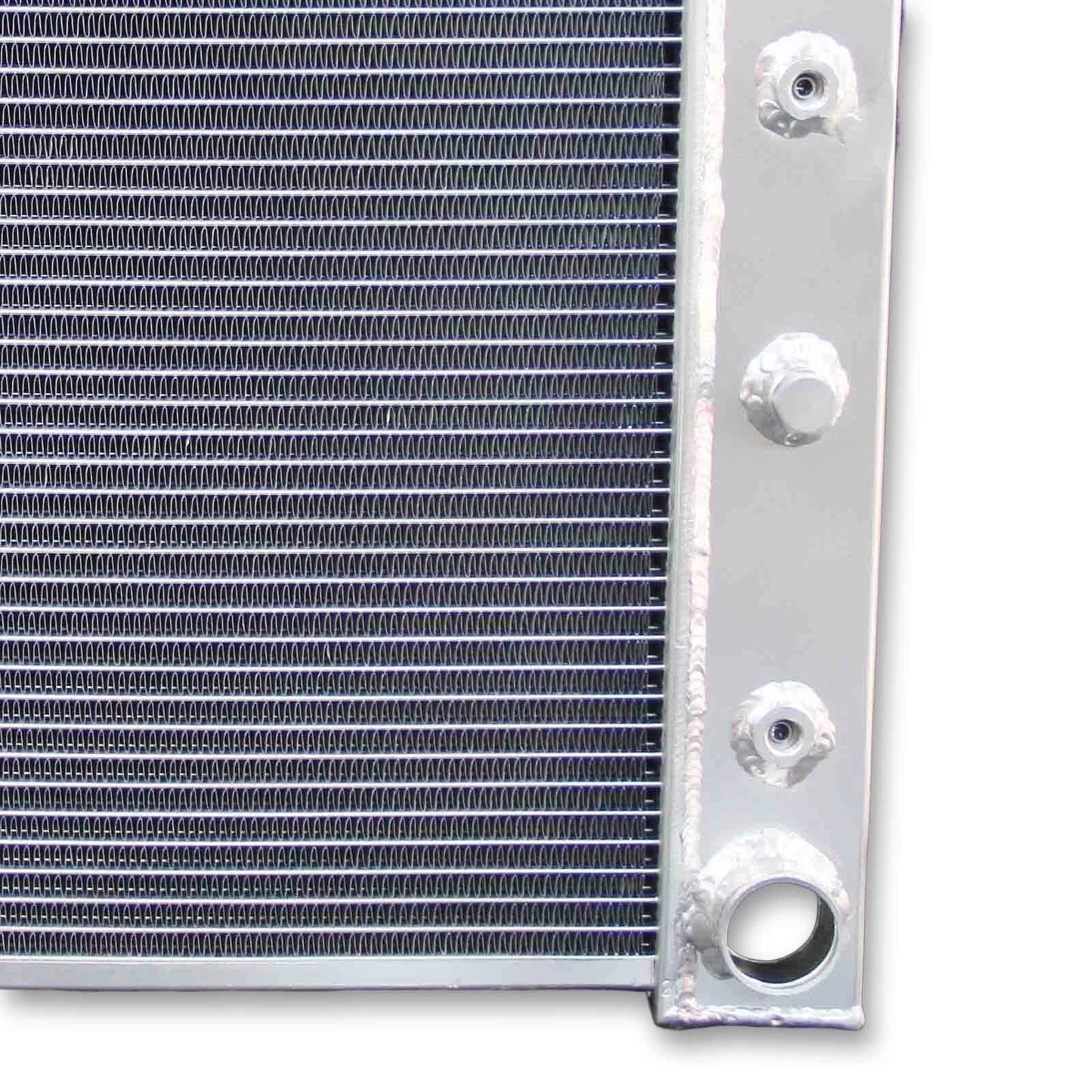 Close-up detail shot of the TIG-welded seams and high-efficiency cooling fins on the 3 row aluminum radiator for 1968-1979 Chevy models.
