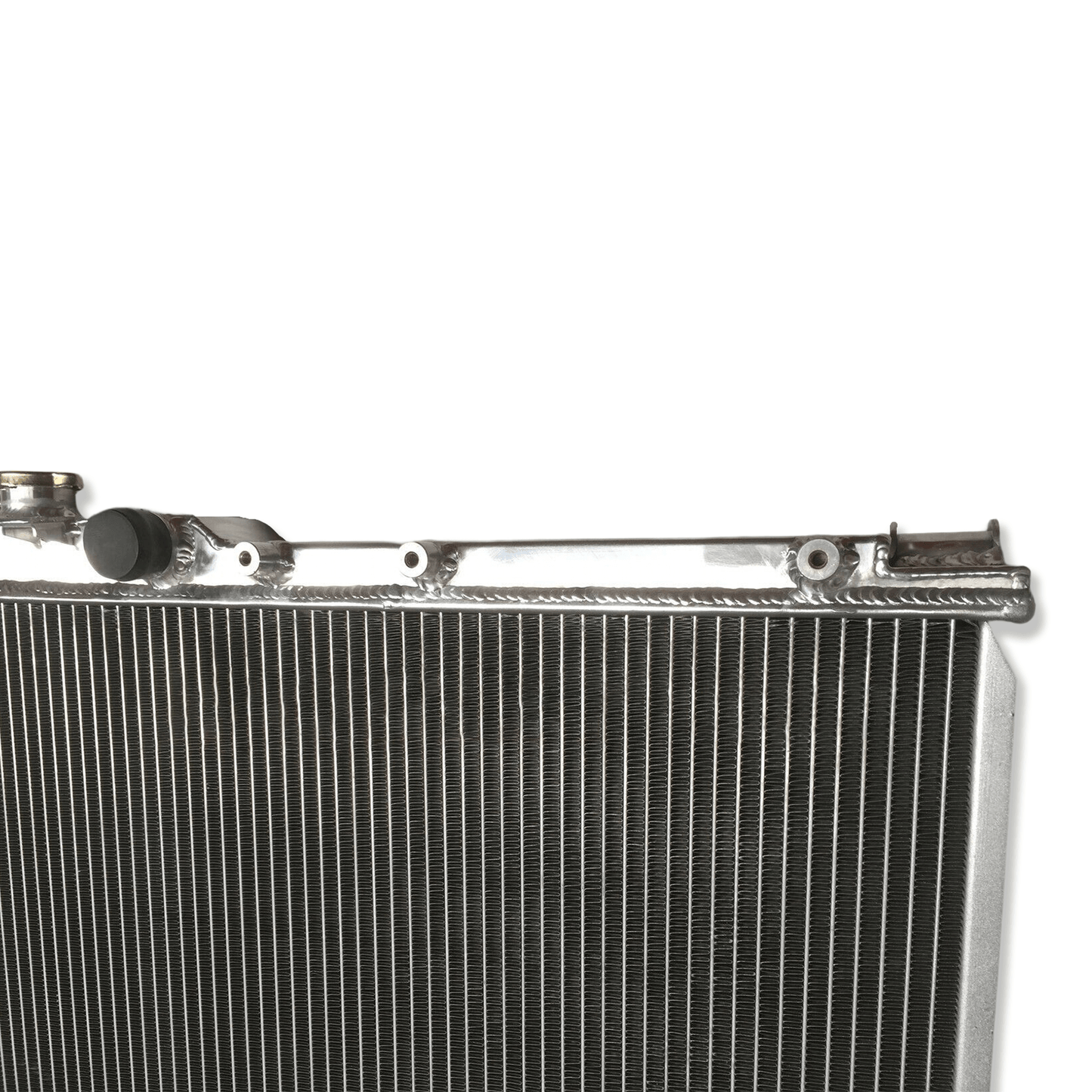 Close-up detail of the precision TIG welds on the aluminum radiator for the Celica GT-Four, built to withstand the high pressures of a tuned 3S-GTE.