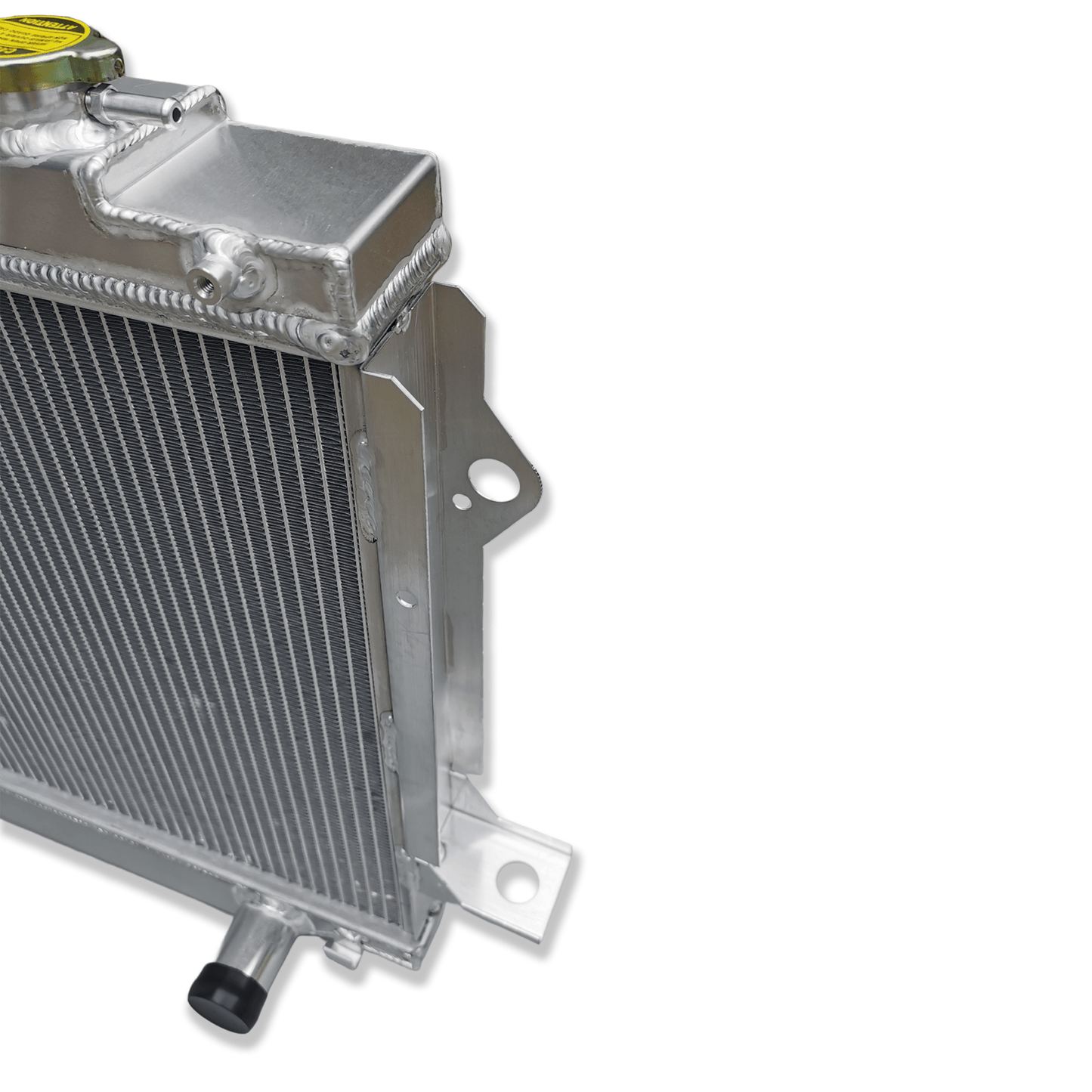 Close-up detail of the precision TIG welds on the aluminum radiator for the Landcruiser 80 Series, demonstrating the build quality needed for demanding off-road use.