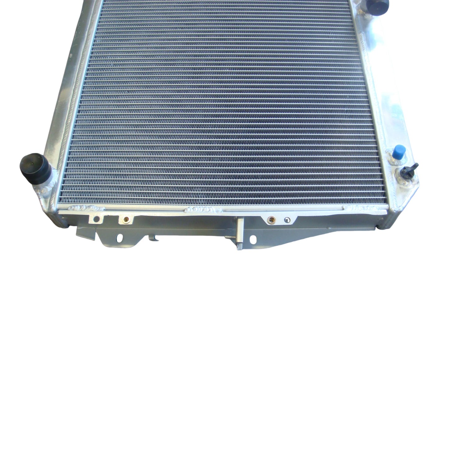 Close-up detail of the precision TIG welds on the aluminum radiator, built for the reliability needed in a classic Toyota Hilux Surf.