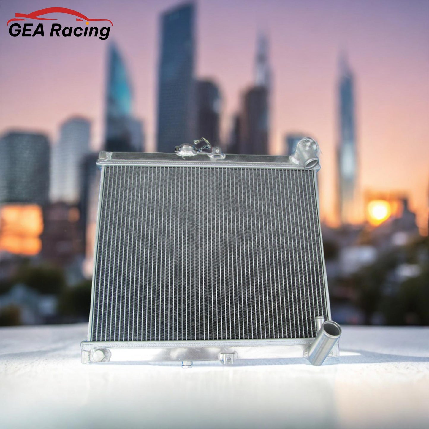 A 3-row performance aluminum radiator installed in a clean Mazda RX-7 FC3S engine bay, an essential upgrade for any 13B rotary.