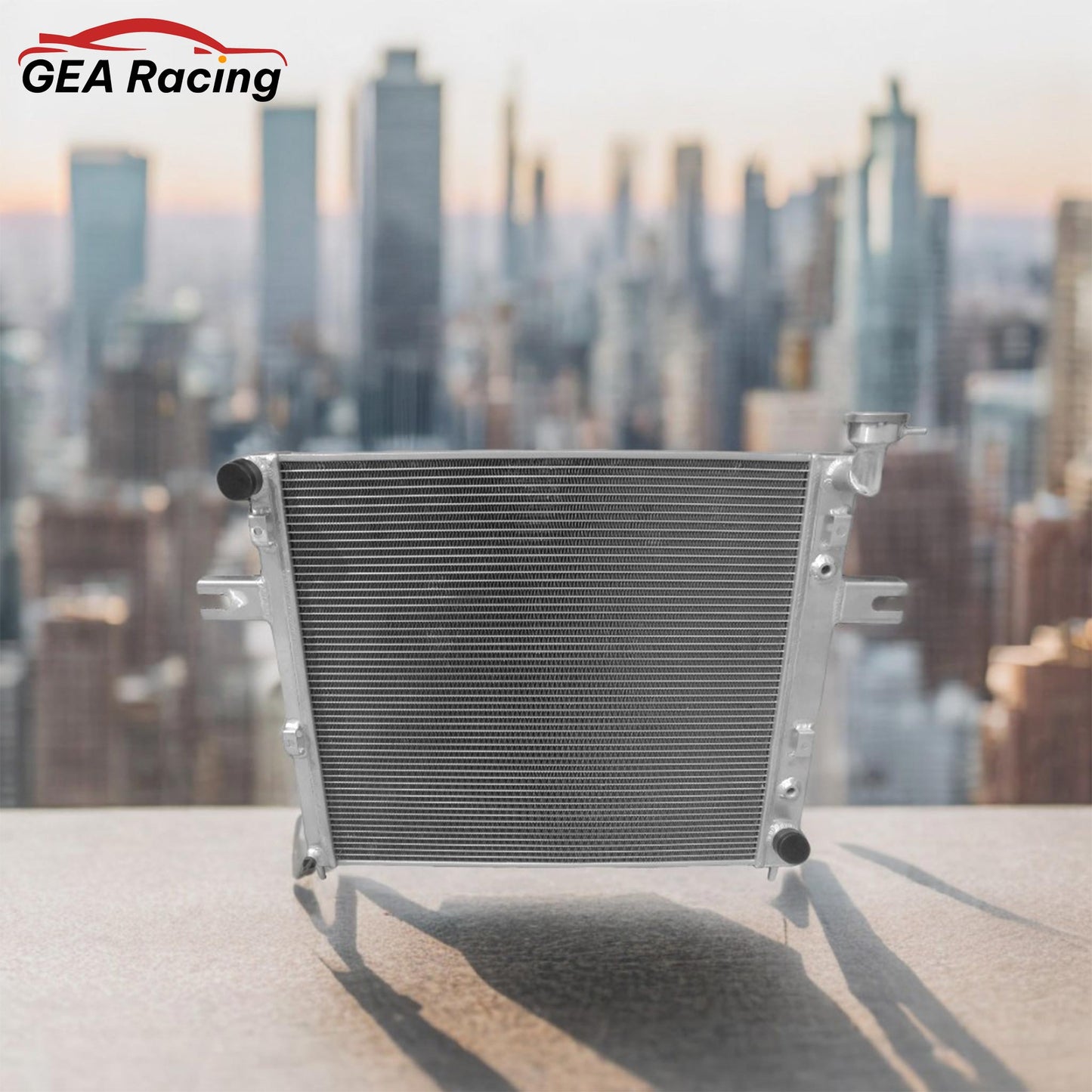 Performance aluminum radiator installed in the engine bay of a Jeep Grand Cherokee WJ/WG 4.7L V8, illustrating a perfect direct-fit replacement and enhanced cooling setup.