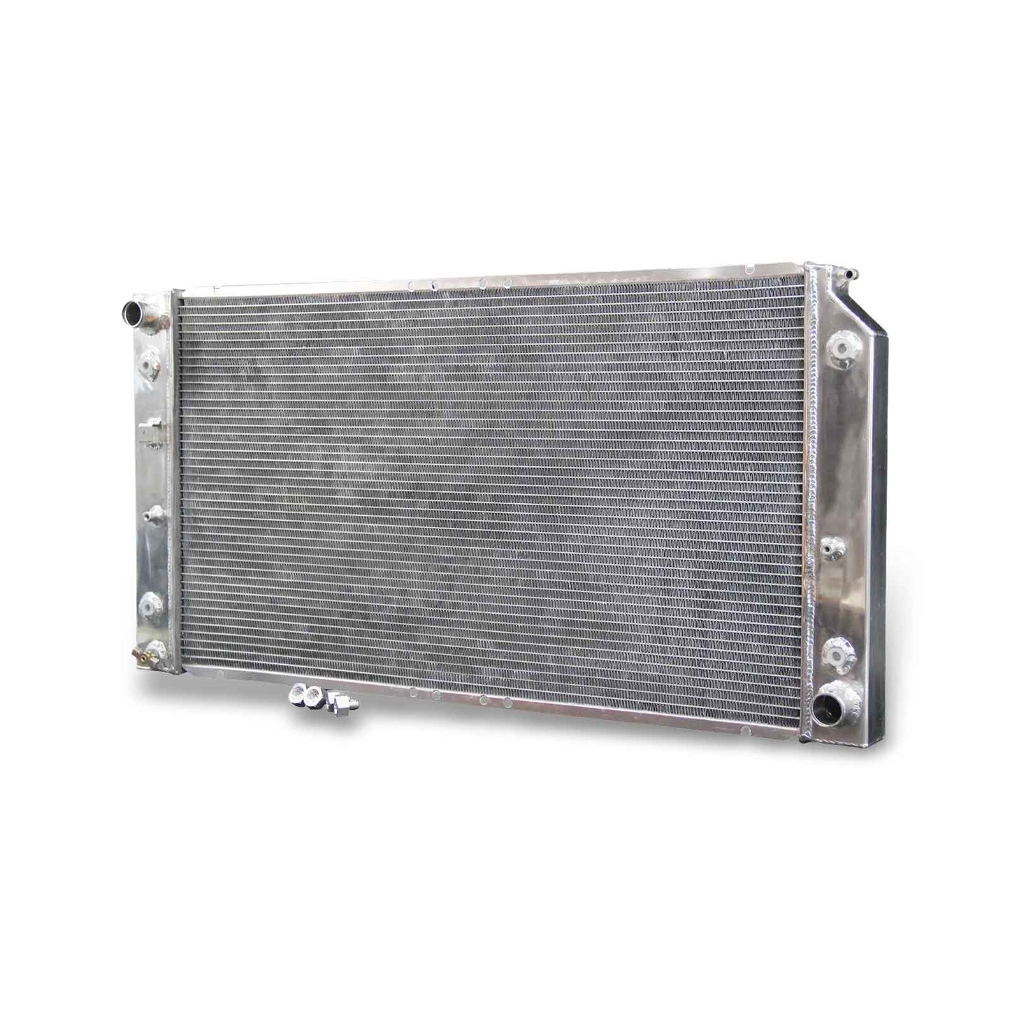 Right side of the aluminum radiator for a 1994-96 Chevrolet Impala 5.7L V8, detailing the lower outlet hose connection and the durable frame construction.