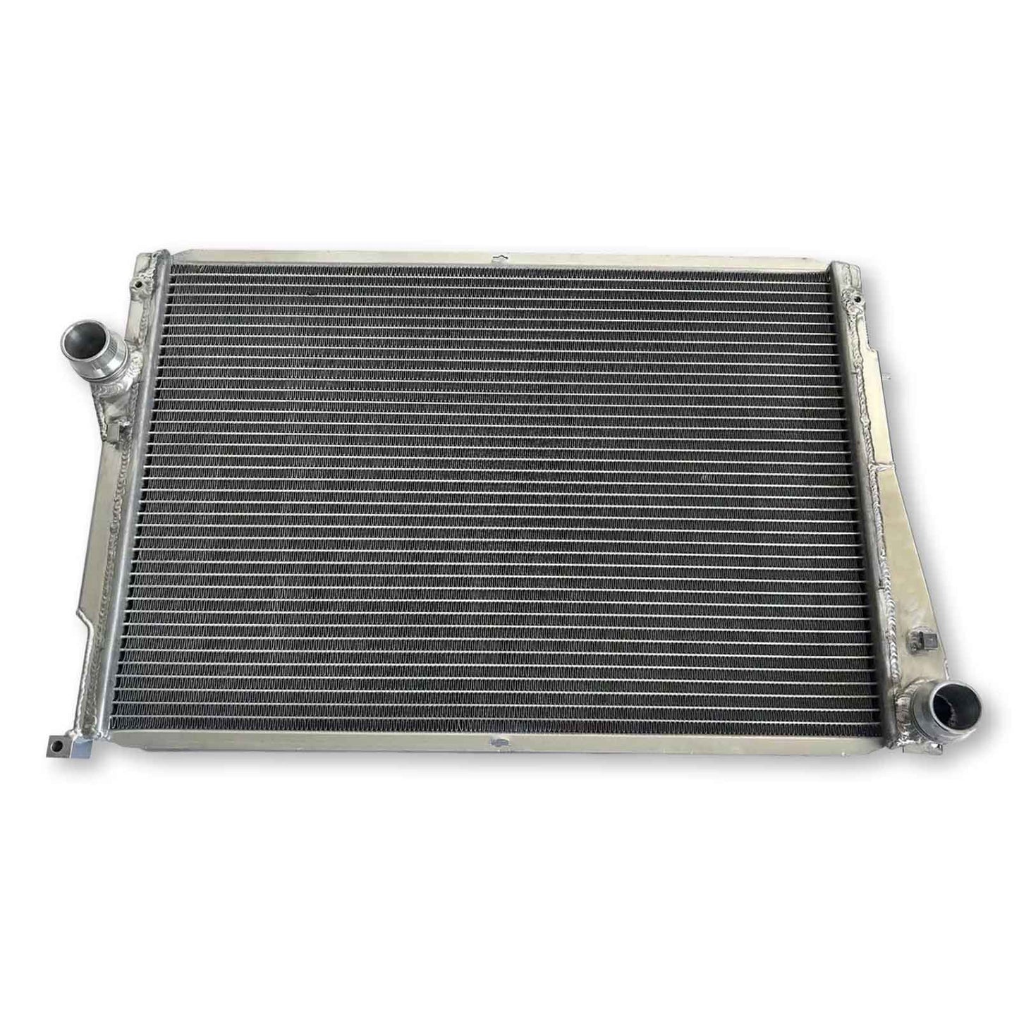 Top-down view of the 3-row aluminum radiator for the E46 M3, highlighting the bleeder screw and fully TIG-welded construction for MT cars.