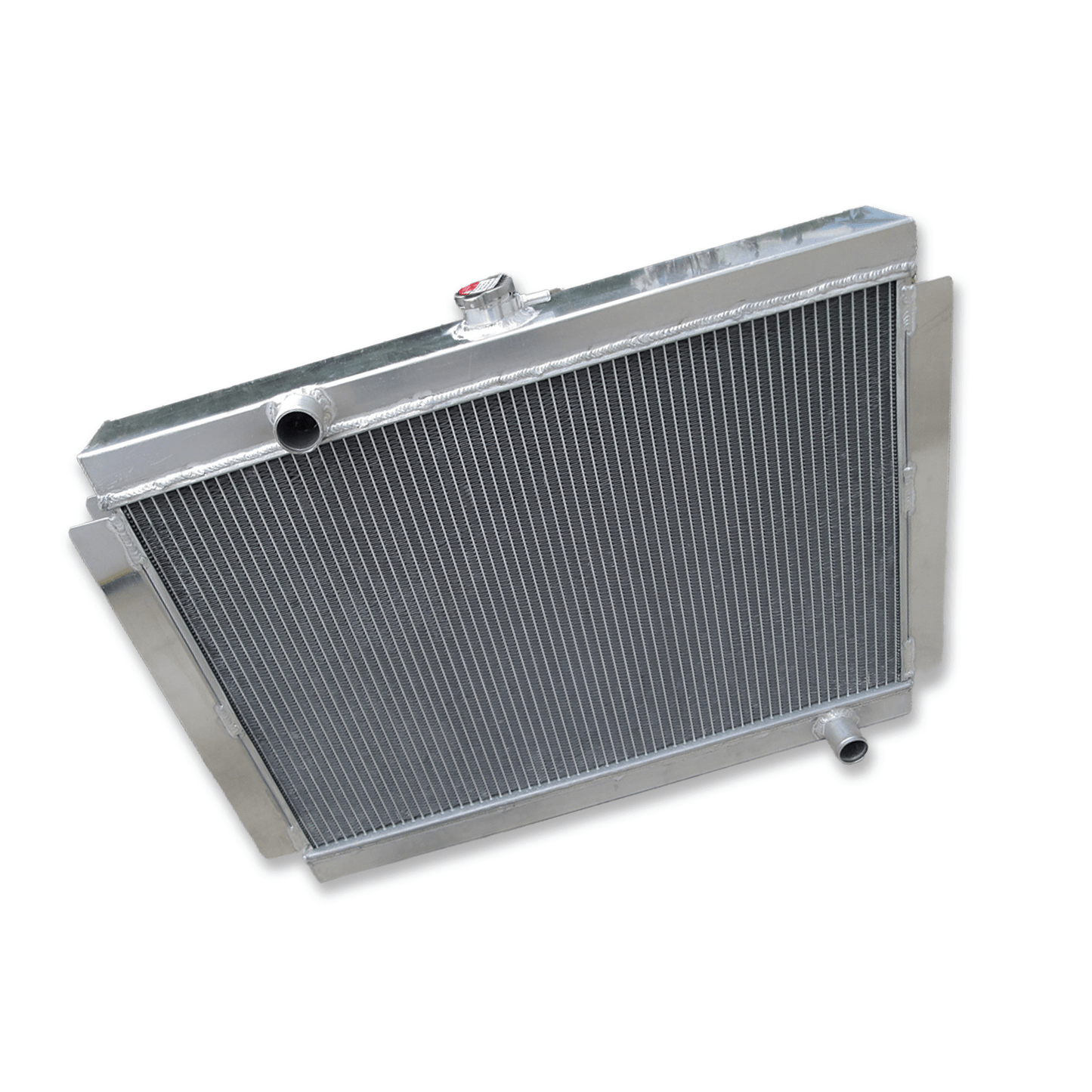 Top-down view of the Datsun 280Z & 280ZX aluminum radiator, showing the high-pressure radiator cap, filler neck, and upper mounting points for the S30 and S130 chassis.