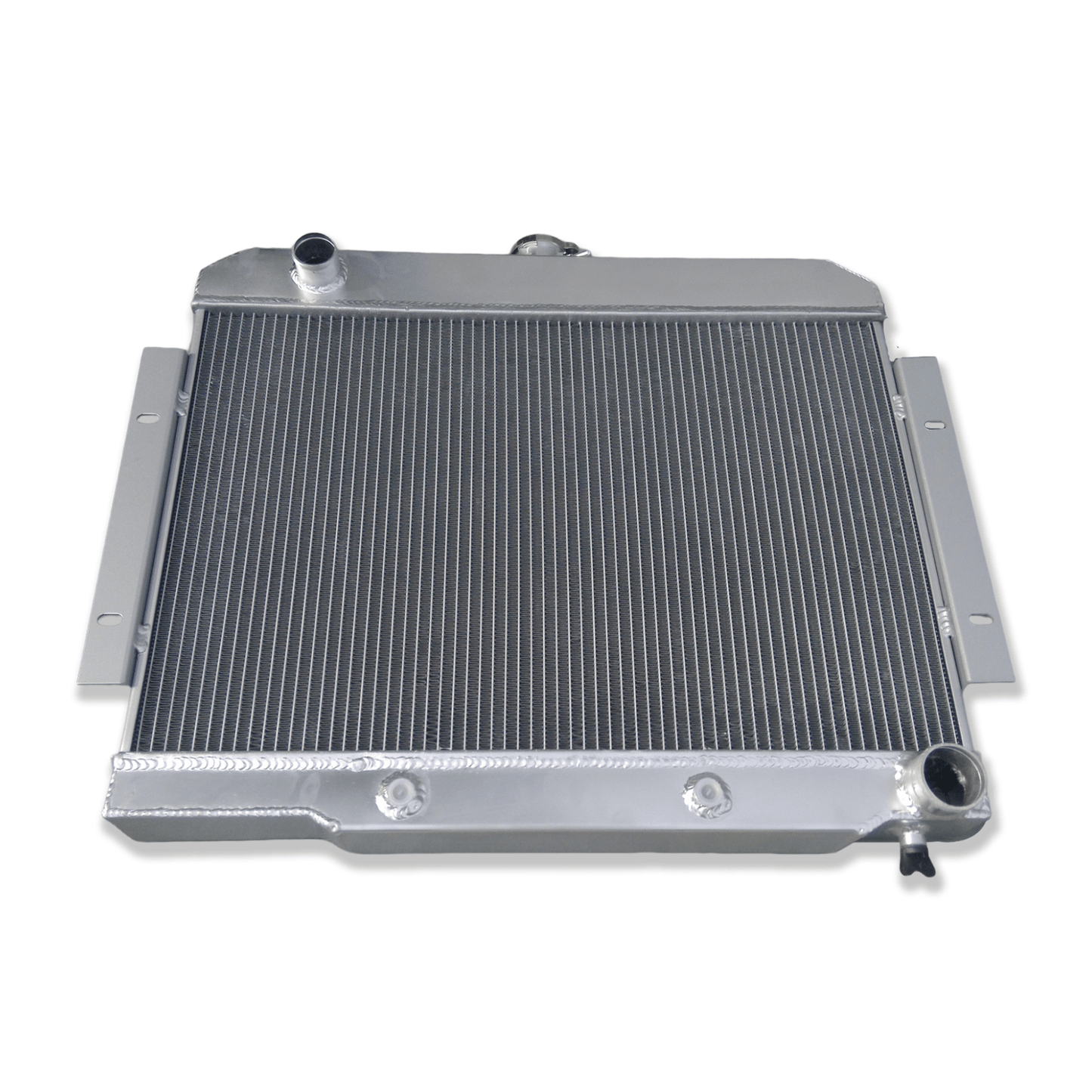 Top-down view of the radiator for a Jeep CJ V8 conversion, displaying the high-pressure cap and heavy-duty construction.