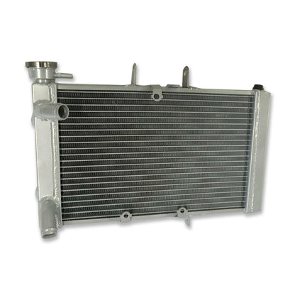 Rear view of the aluminum radiator for Triumph Tiger 800 (2010-2014), highlighting the welded tanks and connections.