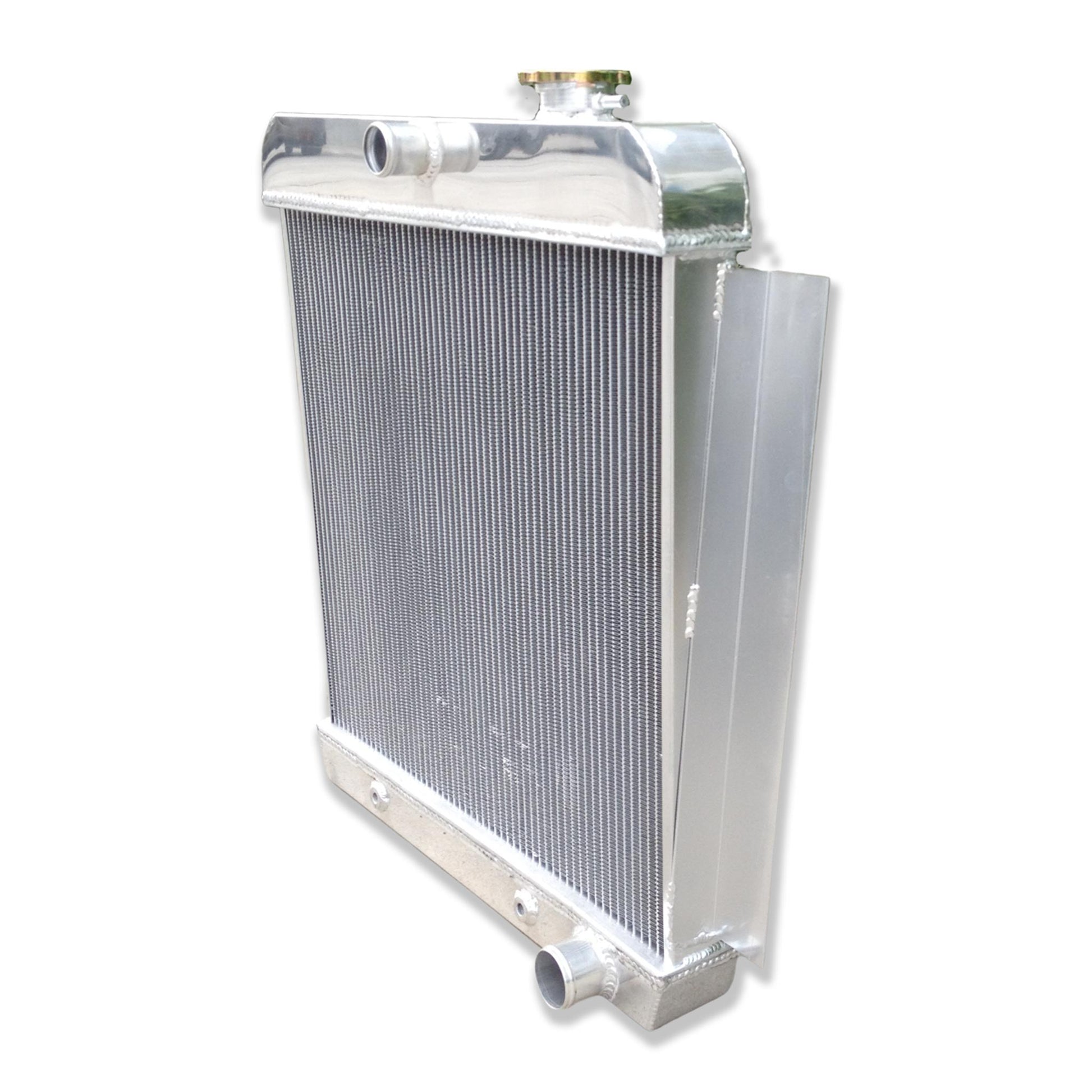 Right side profile of the aluminum radiator for a 1956 Chevy pickup, showing the passenger-side port and sturdy construction.