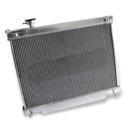Rear view of the 3 Row Aluminum Radiator for a Chevy Trailblazer/GMC Envoy, highlighting the integrated automatic transmission cooler ports.