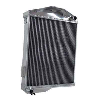 Right side profile of the aluminum radiator for a classic Austin-Healey, showing the polished finish and inlet/outlet port design.