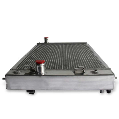 Detailed close-up of the TIG-welded tank and brass petcock drain on the 3 Row Aluminum Radiator for a 2002-2005 Chevrolet Cavalier.