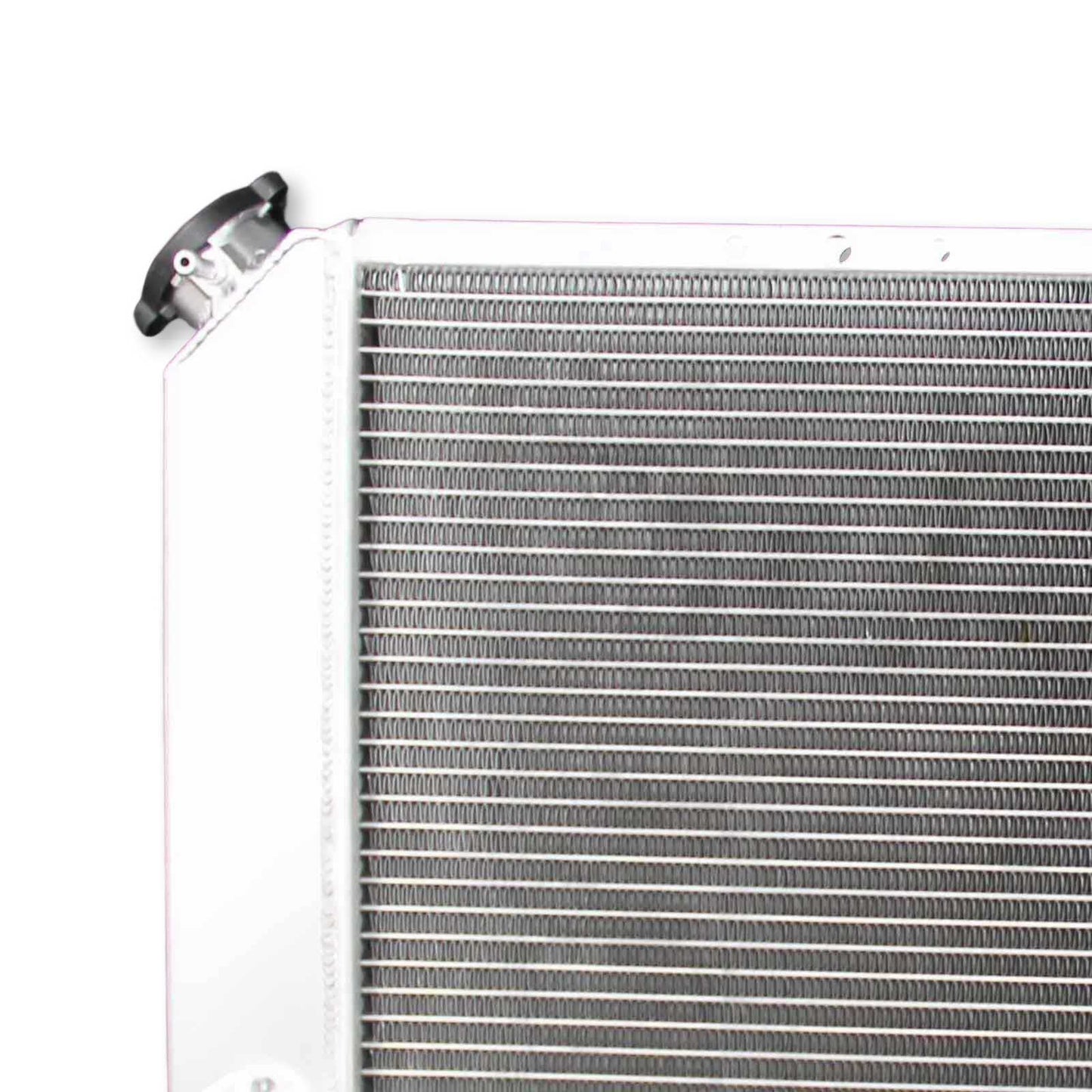 Detailed close-up of the professional TIG welding and high-density cooling fins on the 3 Row Aluminum Radiator for Chevy S10 and GMC Sonoma.