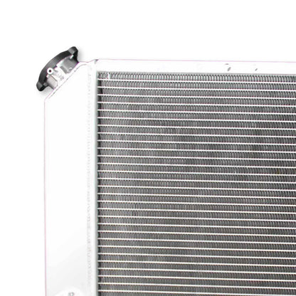 Detailed close-up of the professional TIG welding and high-density cooling fins on the 3 Row Aluminum Radiator for Chevy S10 and GMC Sonoma.