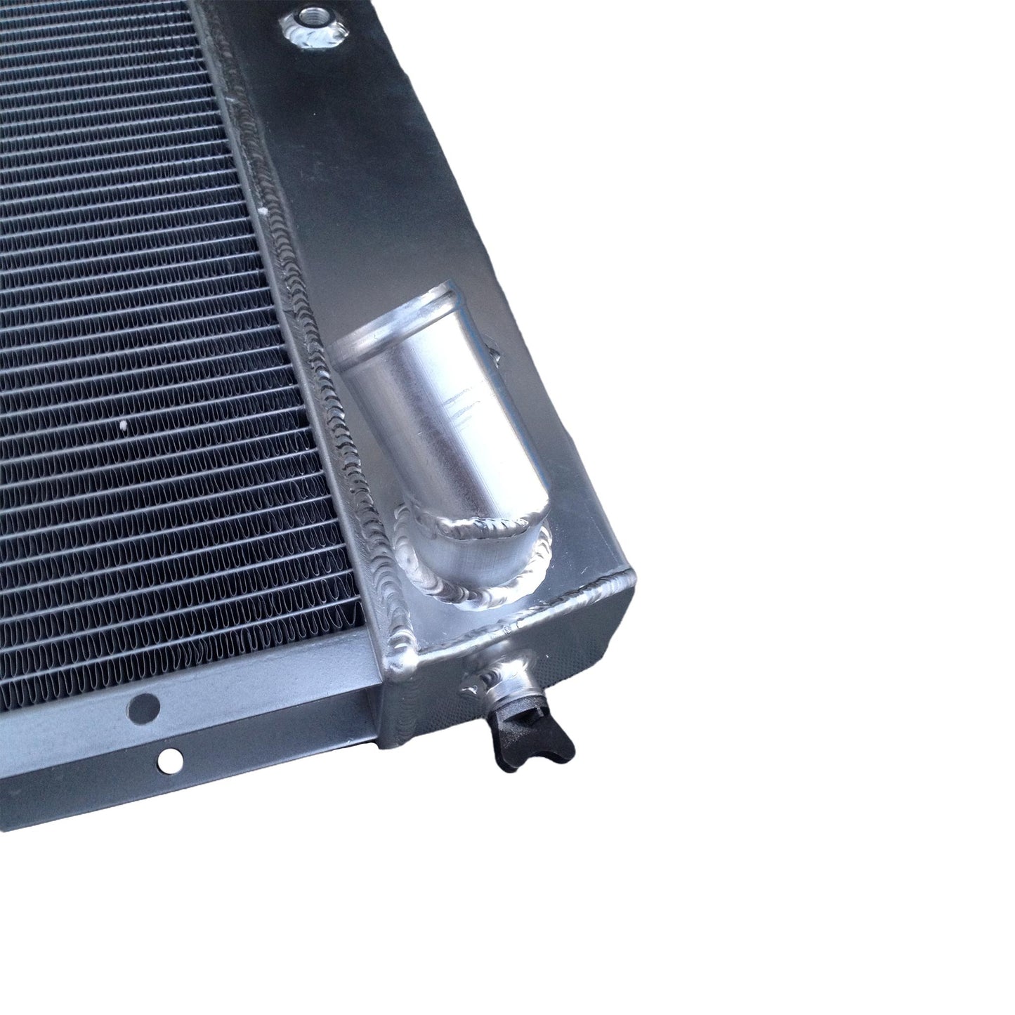 Detailed close-up of the TIG-welded seams and high-efficiency 3-row core on the radiator for a Corvette C3.