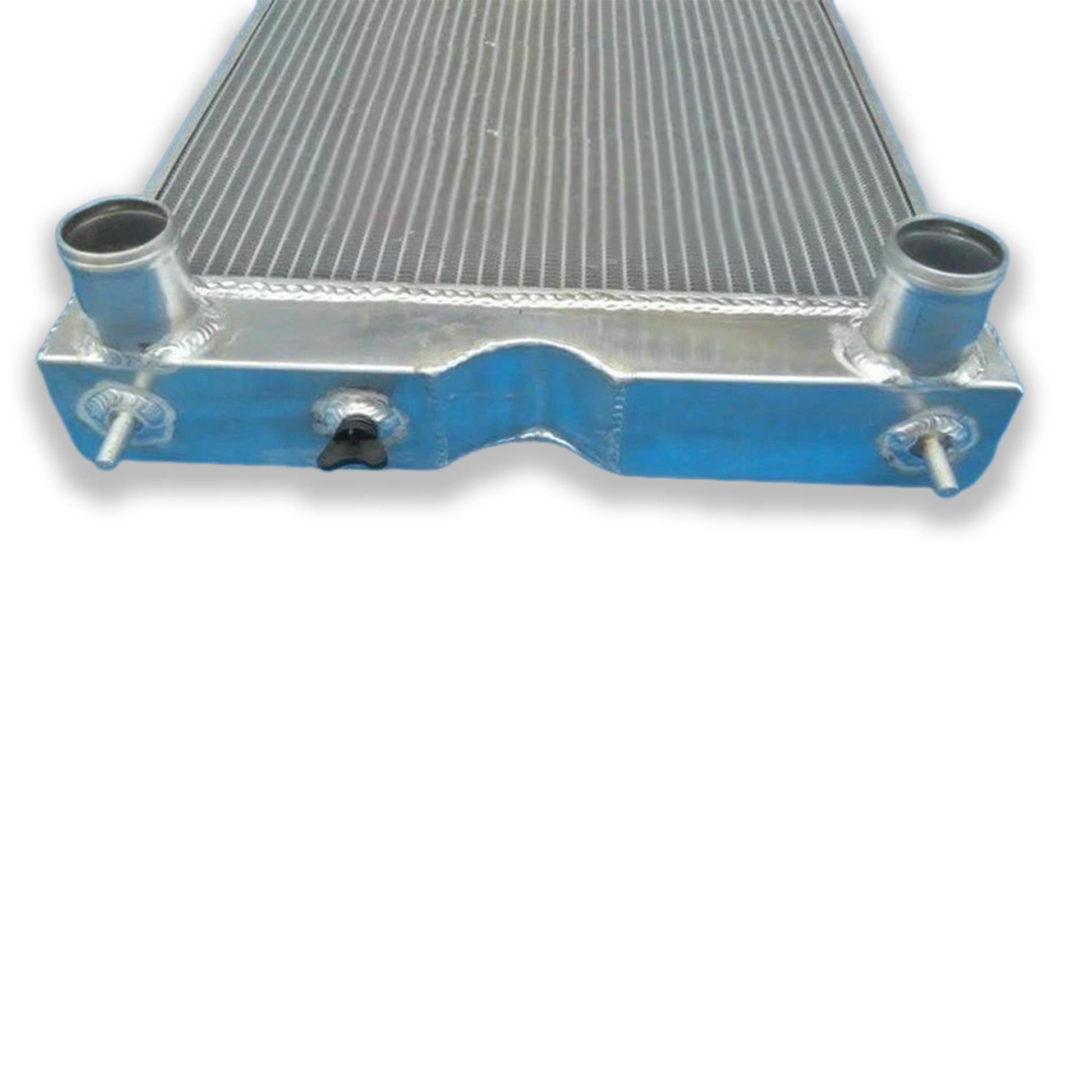 Detailed close-up of the TIG-welded seams and high-efficiency 3-row core on the radiator for a Ford tractor V8 swap.