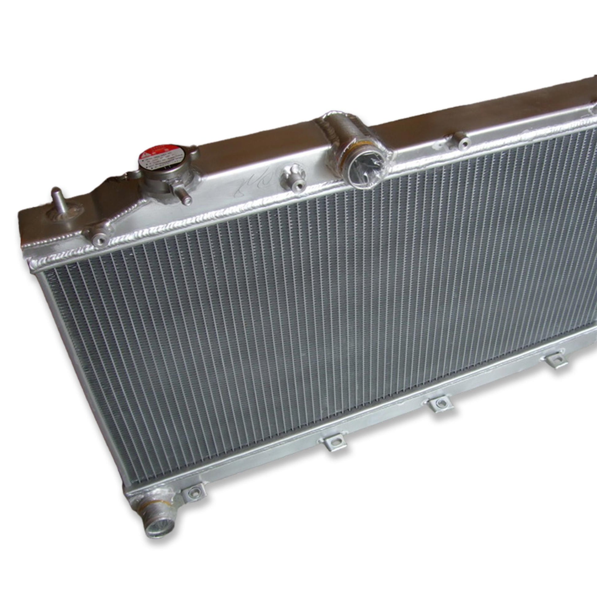 Detailed close-up of the TIG welds and high-efficiency 2-row core of the radiator for a 08-14 Subaru WRX STI.
