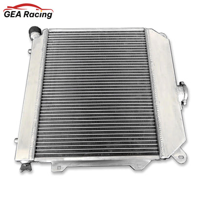 Right side view of the aluminum radiator for BMW E21 M10 engine, detailing the filler neck and cap.