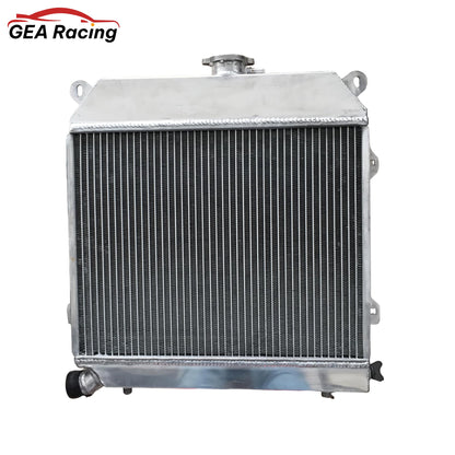 Rear view of the 3-row aluminum radiator for 1977-1983 BMW 320i, showing coolant inlet/outlet and mounting points.