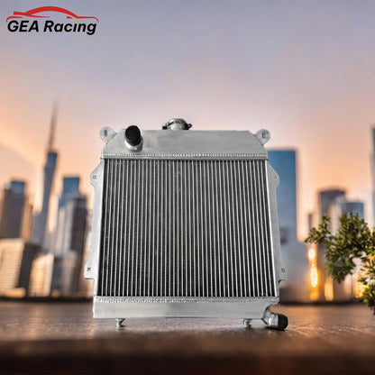 3-row aluminum radiator for BMW E21 320i shown with a compatible high-performance electric fan and shroud kit.