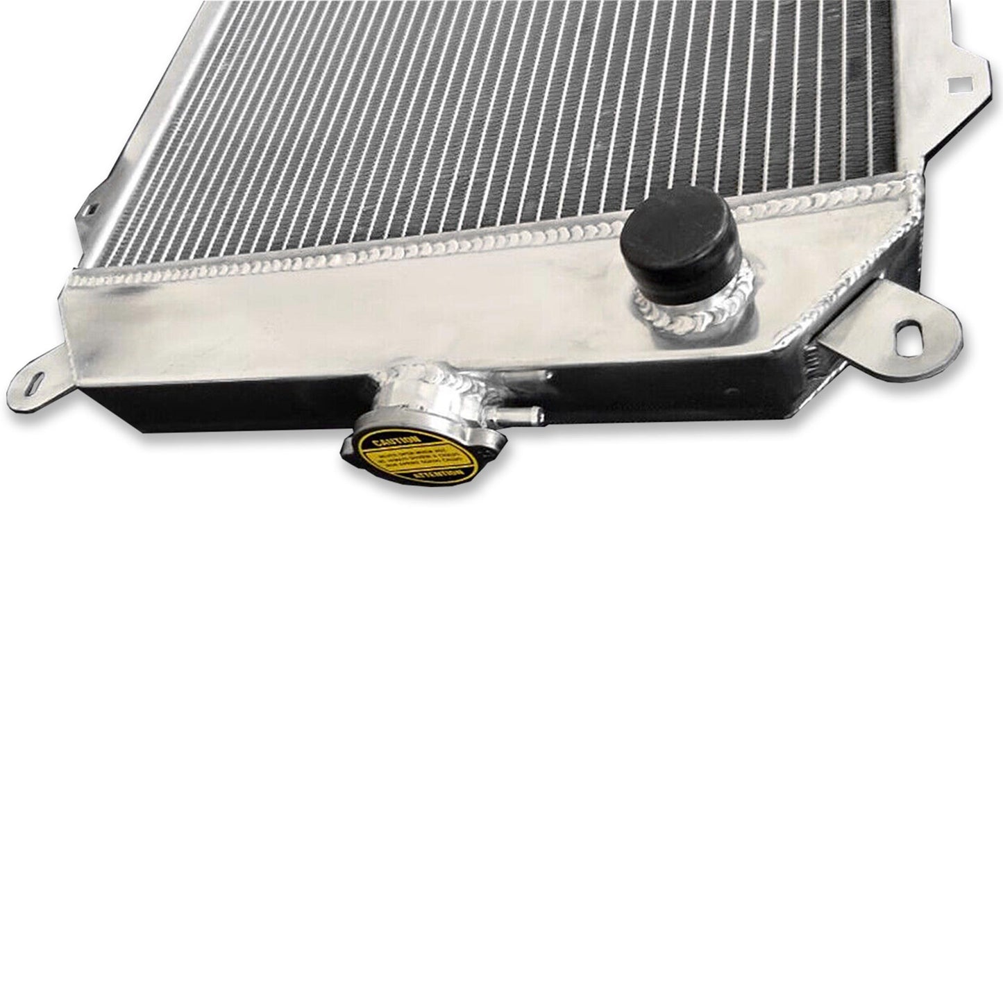 Close-up detail shot of the TIG-welded seams and high-efficiency cooling fins on the BMW E21 3-row radiator.