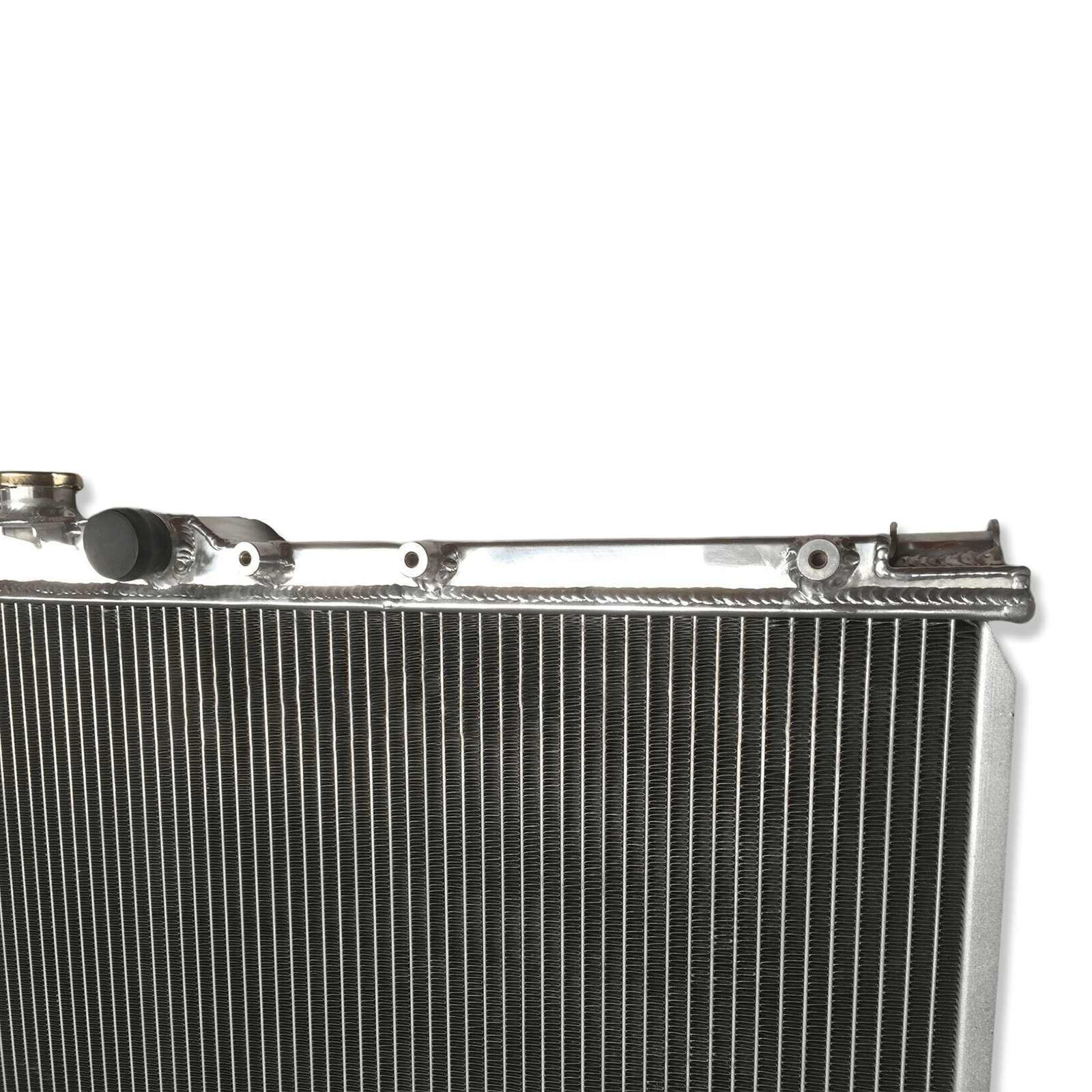 Close-up detail of the precision TIG welds on the aluminum radiator for the Celica GT-Four, built to withstand the high pressures of a tuned 3S-GTE.
