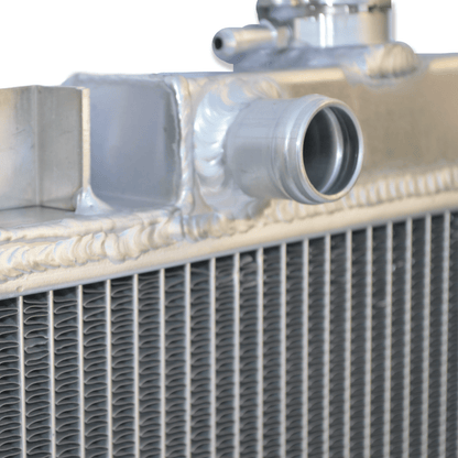 Close-up detail of the precision TIG welds on the aluminum radiator for the Suzuki Swift and Geo Metro, ensuring a durable, leak-proof service life.