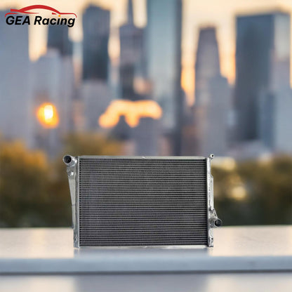 A 3-row aluminum radiator professionally installed in a BMW E46 M3 engine bay, the ultimate cooling solution for the S54 engine.