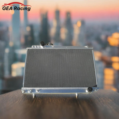 A 3-row performance aluminum radiator installed in a clean Toyota Supra MK3 7M-GTE engine bay, illustrating a perfect fit and a critical cooling system upgrade.