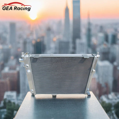 A performance aluminum radiator installed in a clean SAAB 9000 2.3L Turbo engine bay, demonstrating a perfect fit and essential cooling upgrade.