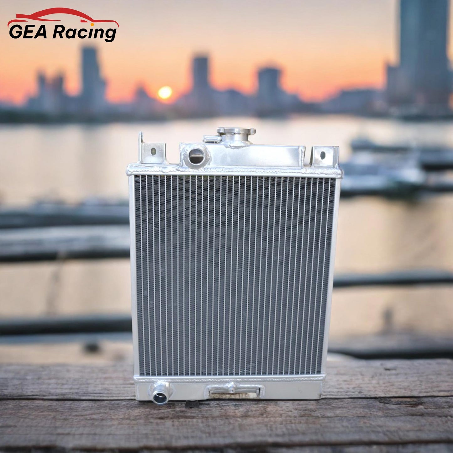 A lightweight aluminum radiator installed in a clean Suzuki Swift GT engine bay, demonstrating a perfect fit and a significant cooling system enhancement.