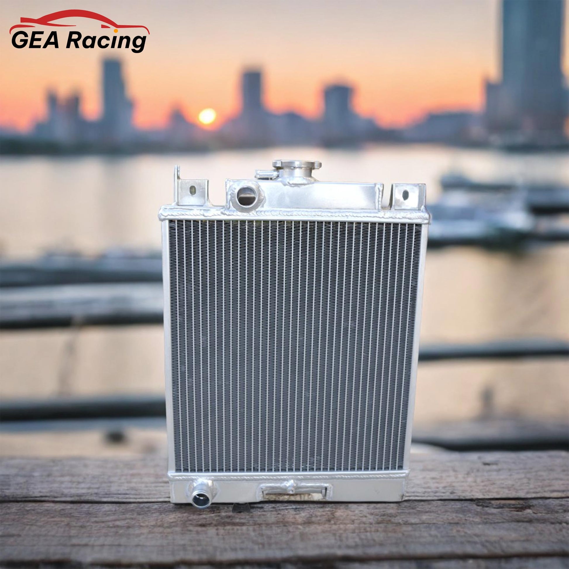 A lightweight aluminum radiator installed in a clean Suzuki Swift GT engine bay, demonstrating a perfect fit and a significant cooling system enhancement.