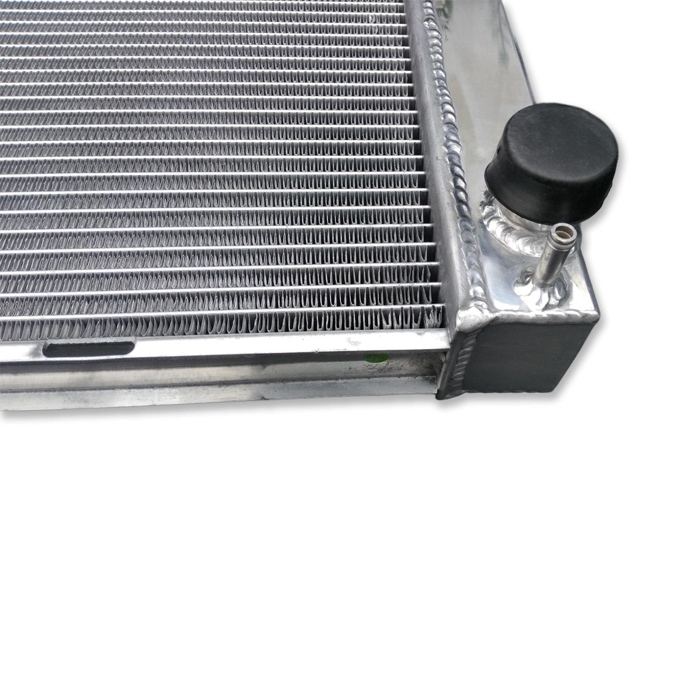 Close-up detail of the TIG-welded seams and high-density cooling fins on the Land Rover Discovery 2 aluminum radiator.