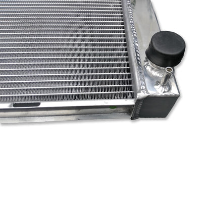 Close-up detail of the TIG-welded seams and high-density cooling fins on the Land Rover Discovery 2 aluminum radiator.