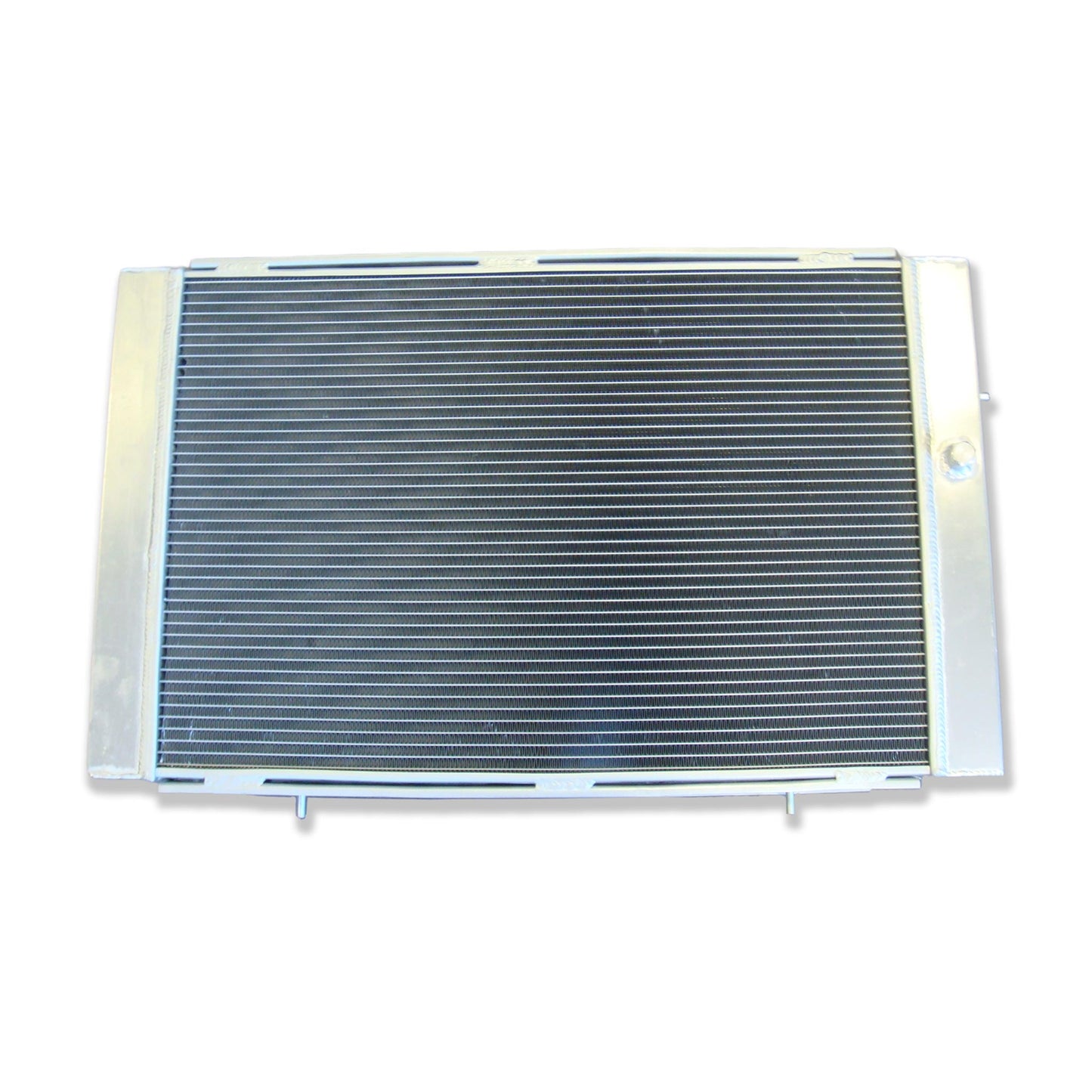 Rear view of the 3-row aluminum radiator for a Holden WB V8, showing the integrated automatic transmission cooler ports for universal AT/MT fit.