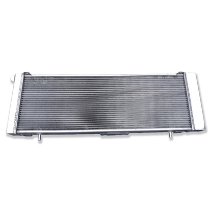 Rear view of the 3-row aluminum radiator for the Jeep Cherokee XJ, showing the integrated automatic transmission cooler ports for AT/MT compatibility.