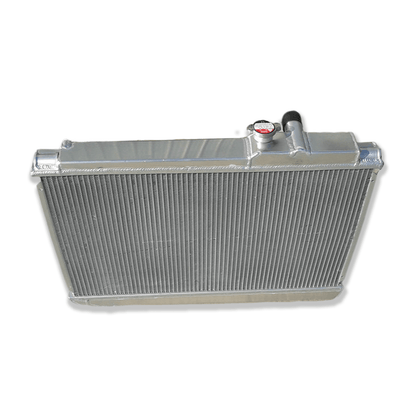 Rear view of the 3-row aluminum radiator for the Toyota Supra MK3, showing the robust construction and factory-style mounting points for a direct MT fitment.