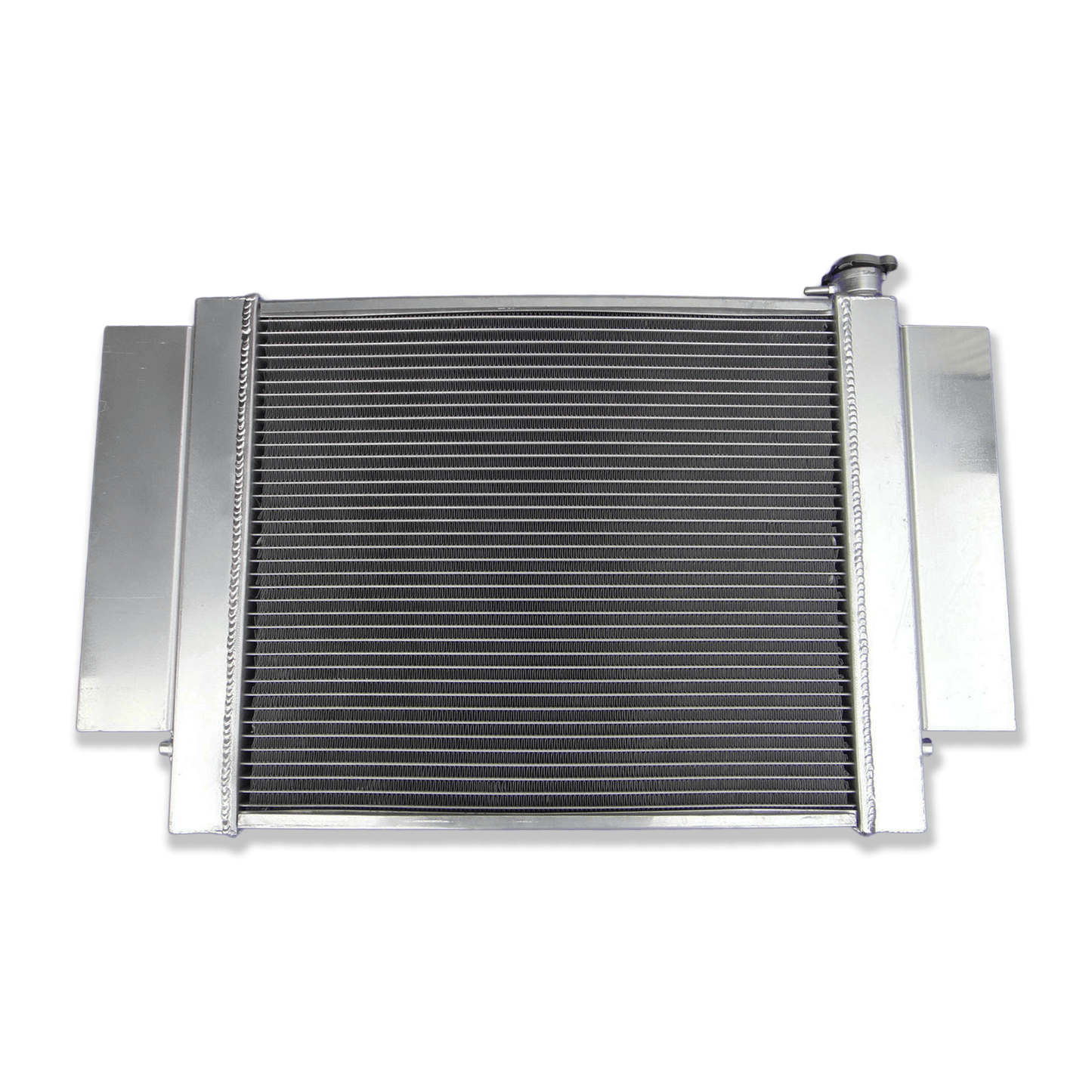 Rear view of the Mazda RX-series S1/S2 aluminum radiator, detailing the integrated heater pipe connection and precise mounting points for a direct-fit installation.