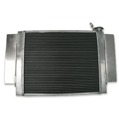 Rear view of the Mazda RX-series S1/S2 aluminum radiator, showing the clean design without a heater pipe connection, intended for simplified, performance-focused engine bays.