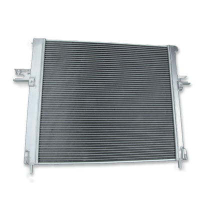 Rear view of the aluminum radiator for Jeep Grand Cherokee 4.7L V8 (1999-2000), detailing the OEM-style mounting points and connections for both automatic and manual transmissions.