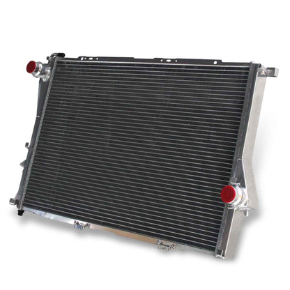Right side view displaying the inlet, outlet, and sensor ports on the 2-row aluminum radiator for a BMW E39 525i, 530i L6 and V8 models.