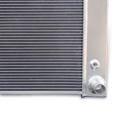 Close-up detail shot of the TIG-welded seams and high-density cooling fins on the 3-row aluminum radiator for Chevrolet Express.