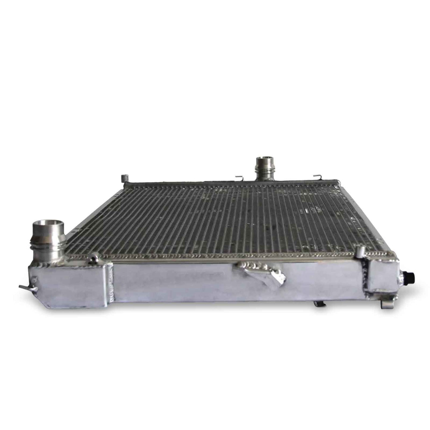 Top-down view of the 2-row aluminum radiator for the BMW E46/Z4, highlighting the bleeder screw, mounting points, and all-aluminum construction for MT cars.