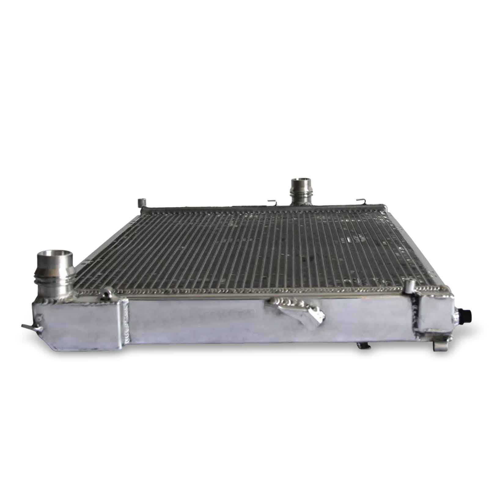 Top-down view of the 2-row aluminum radiator for the BMW E46/Z4, highlighting the bleeder screw, mounting points, and all-aluminum construction for MT cars.
