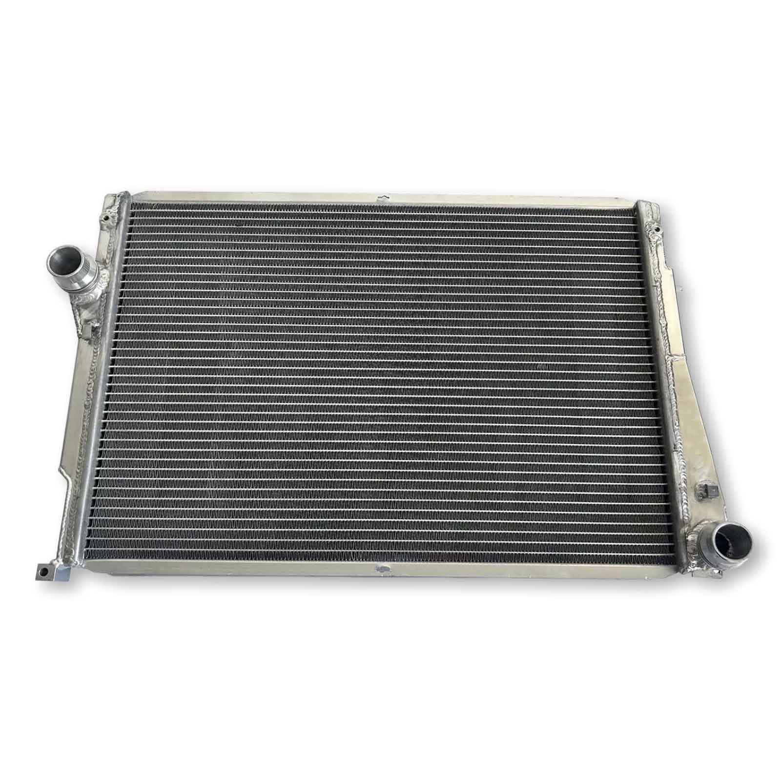 Top-down view of the 3-row aluminum radiator for the E46 M3, highlighting the bleeder screw and fully TIG-welded construction for MT cars.