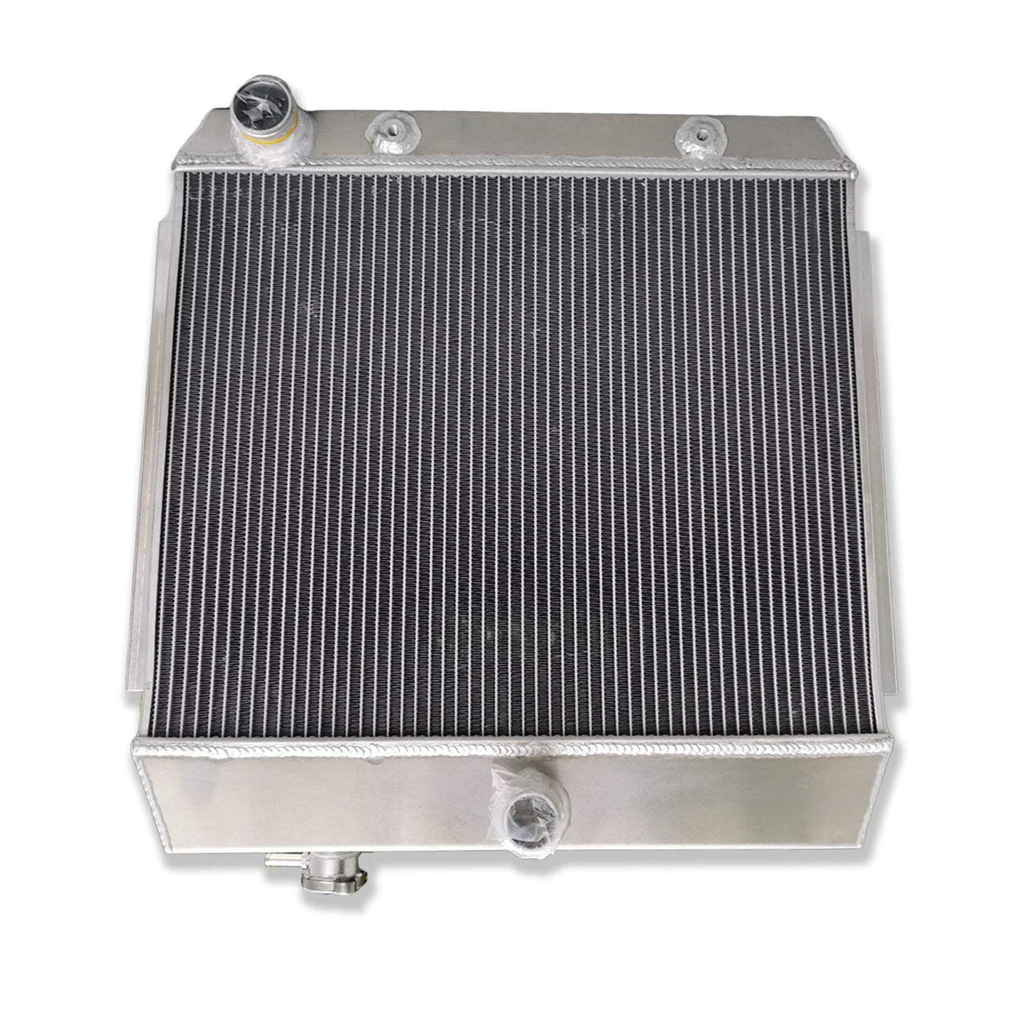 Top-down view of the 3-row radiator for a '57 Chevy V8, displaying the high-pressure cap and triple-core design.