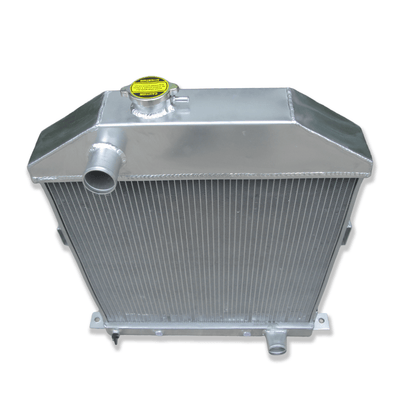 Top-down view of the 3-row radiator for the Ford Flathead V8, displaying the authentic-style filler neck and triple-core design.