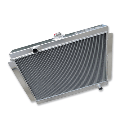 Top-down view of the Datsun 280Z & 280ZX aluminum radiator, showing the high-pressure radiator cap, filler neck, and upper mounting points for the S30 and S130 chassis.